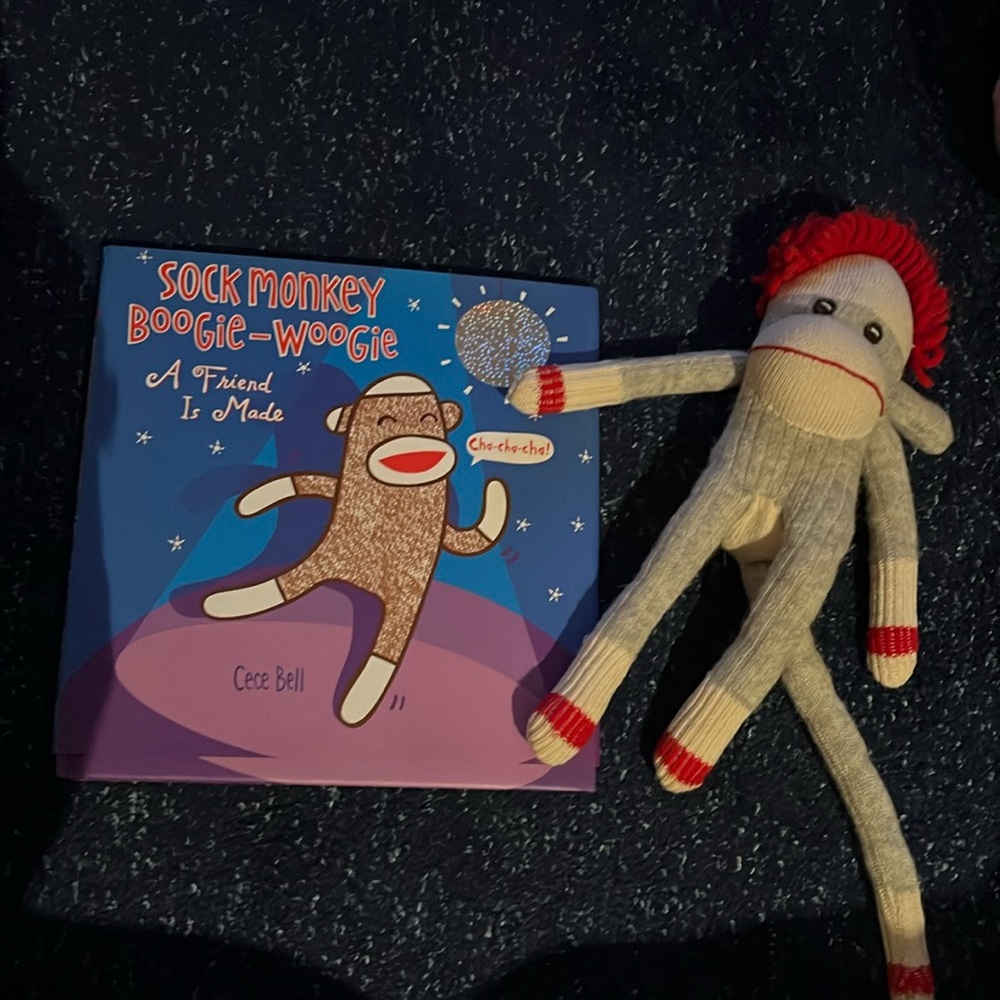 Sock monkey and book like new